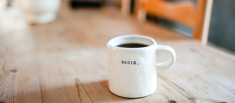 coffee cup with the word begin
